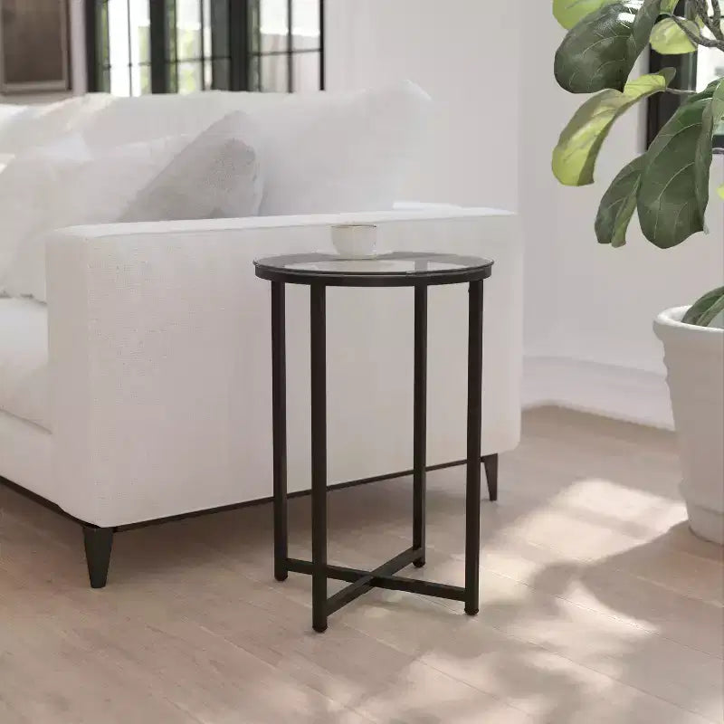 Table basse en verre avec piètement métallique croisé